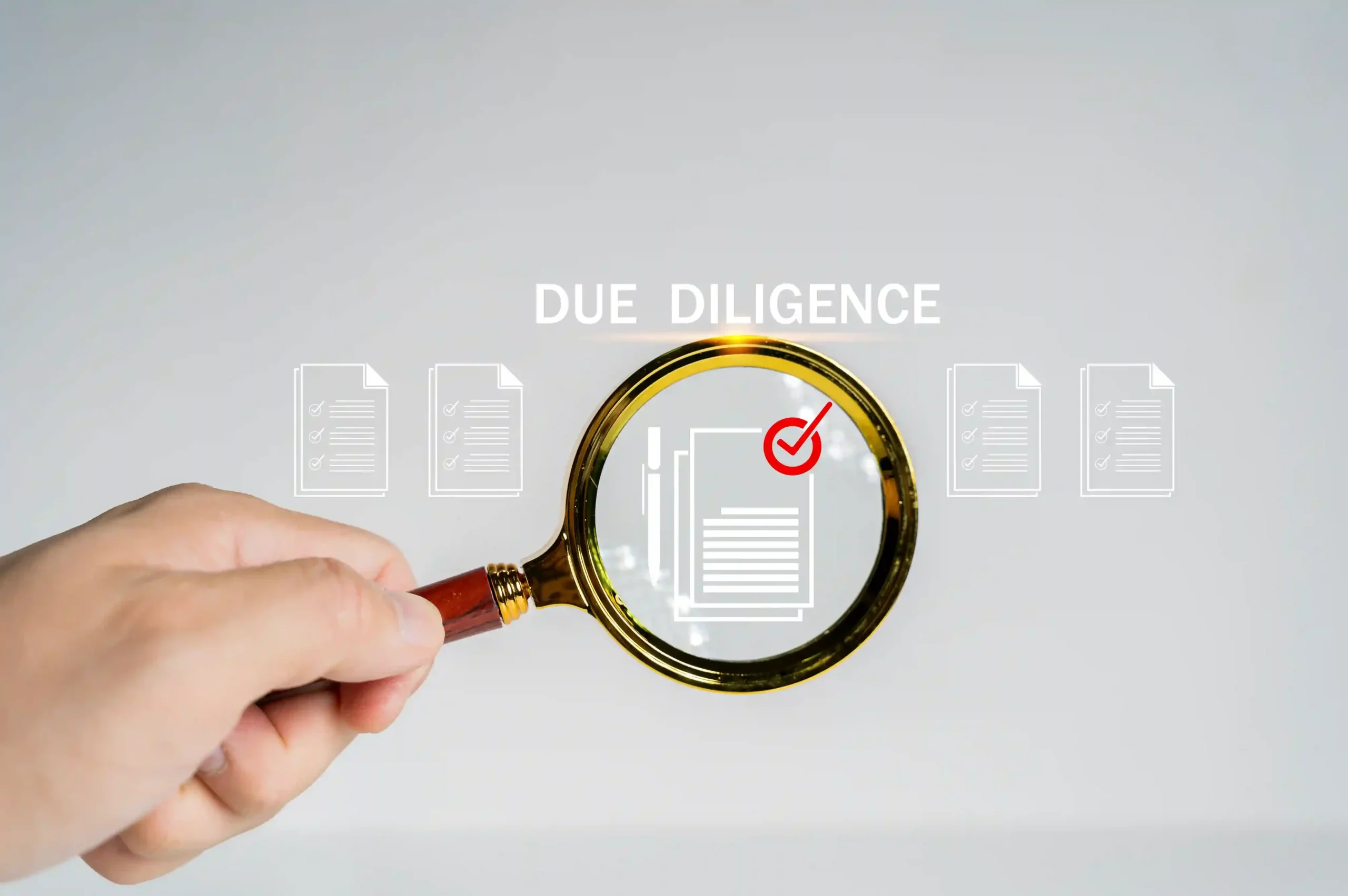 due-diligence-concept-businessman-using-magnifying-glass-with-due-diligence-icon-virtual-screen-due-diligence_11zon