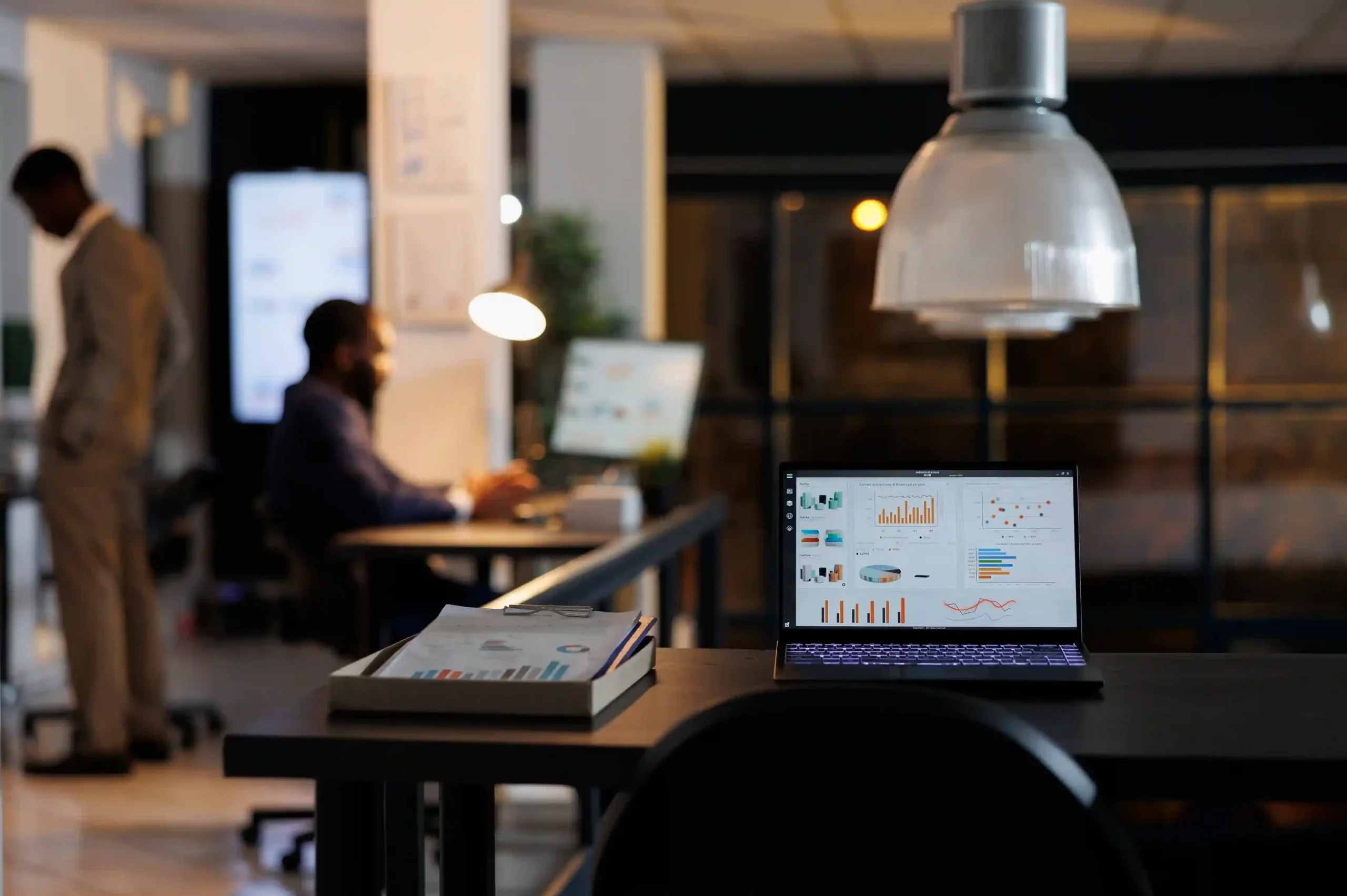 laptop-computer-with-marketing-statistics-standing-desk_11zon_11zon