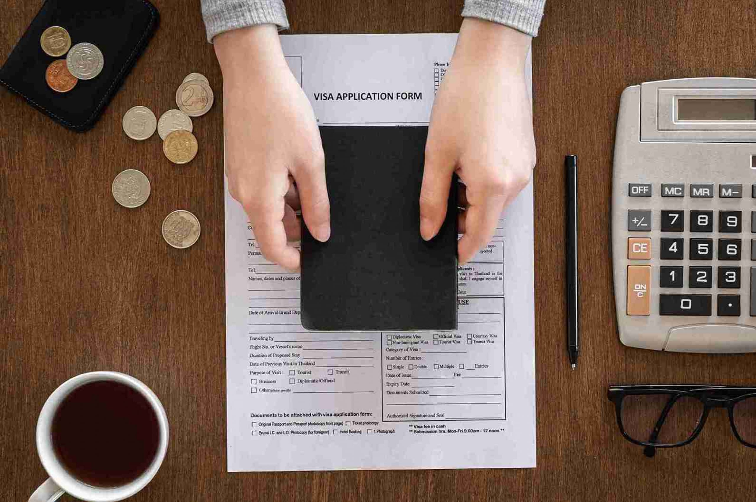 visa-application-form-wooden-table-visa-processing-registration-flat-lay_11zon